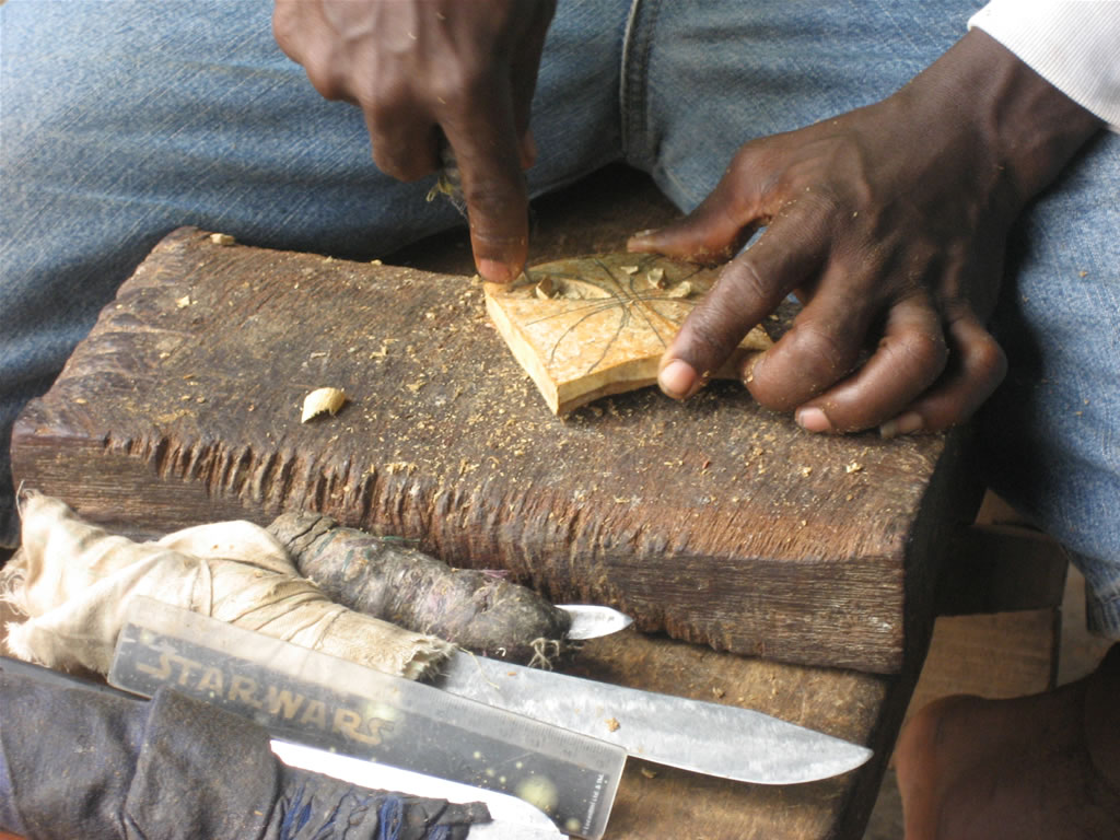 Removing larger pieces in carving an adinkra stamp