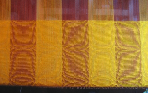 goldenrod shawl on the loom.