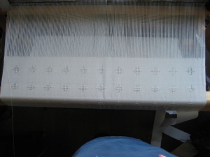 The shawl on the loom.