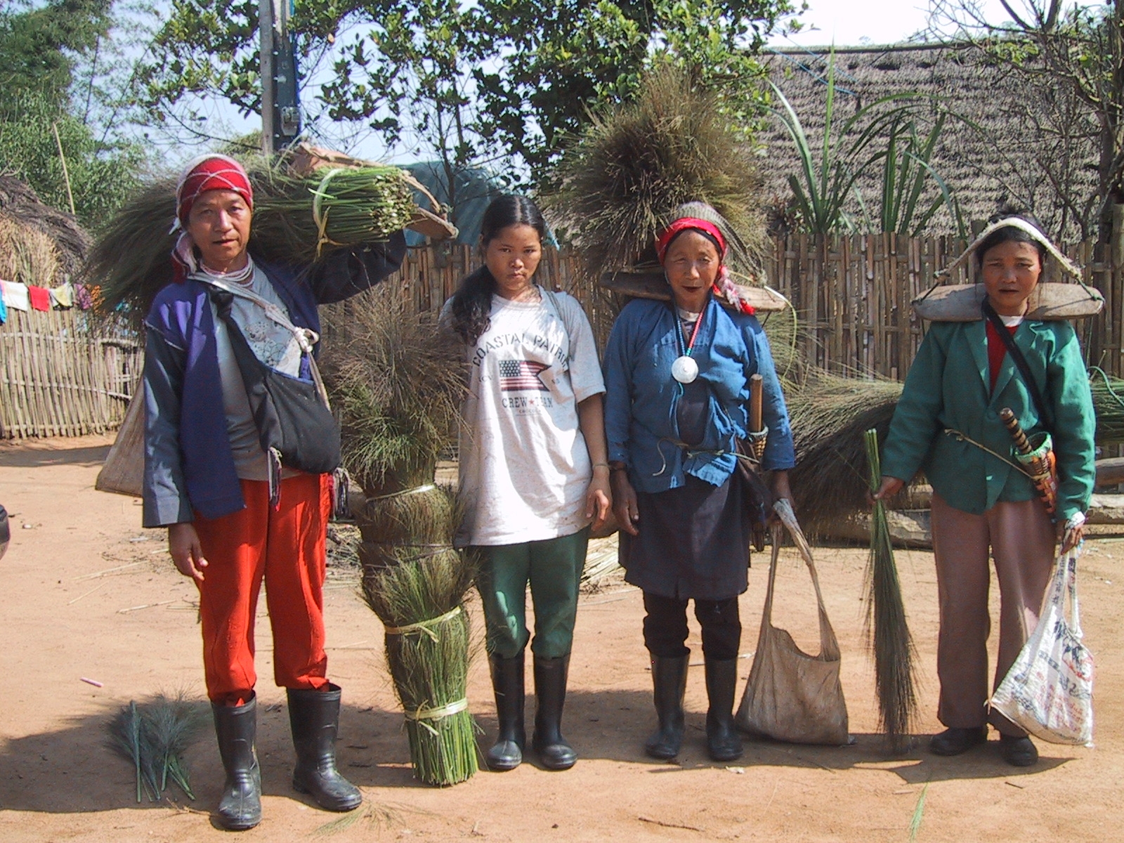 Akha Women Carrying Reeds