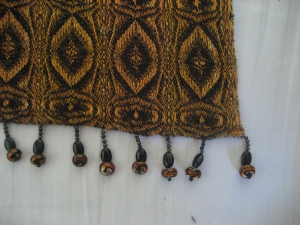 A closeup of the tiger eye pattern, showing off the beads.