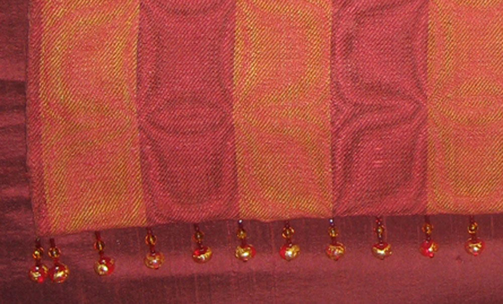 Closeup of the garnet shawl, showing the beads.