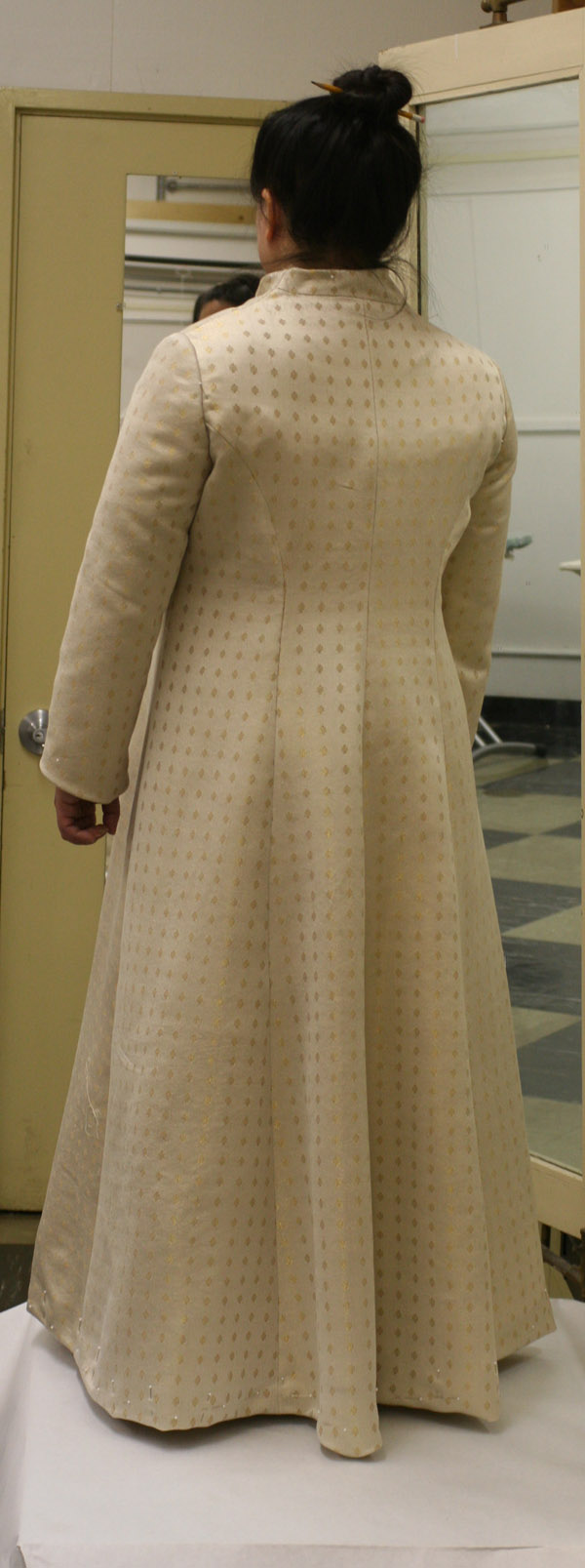 Rear view of the partially finished handwoven wedding coat