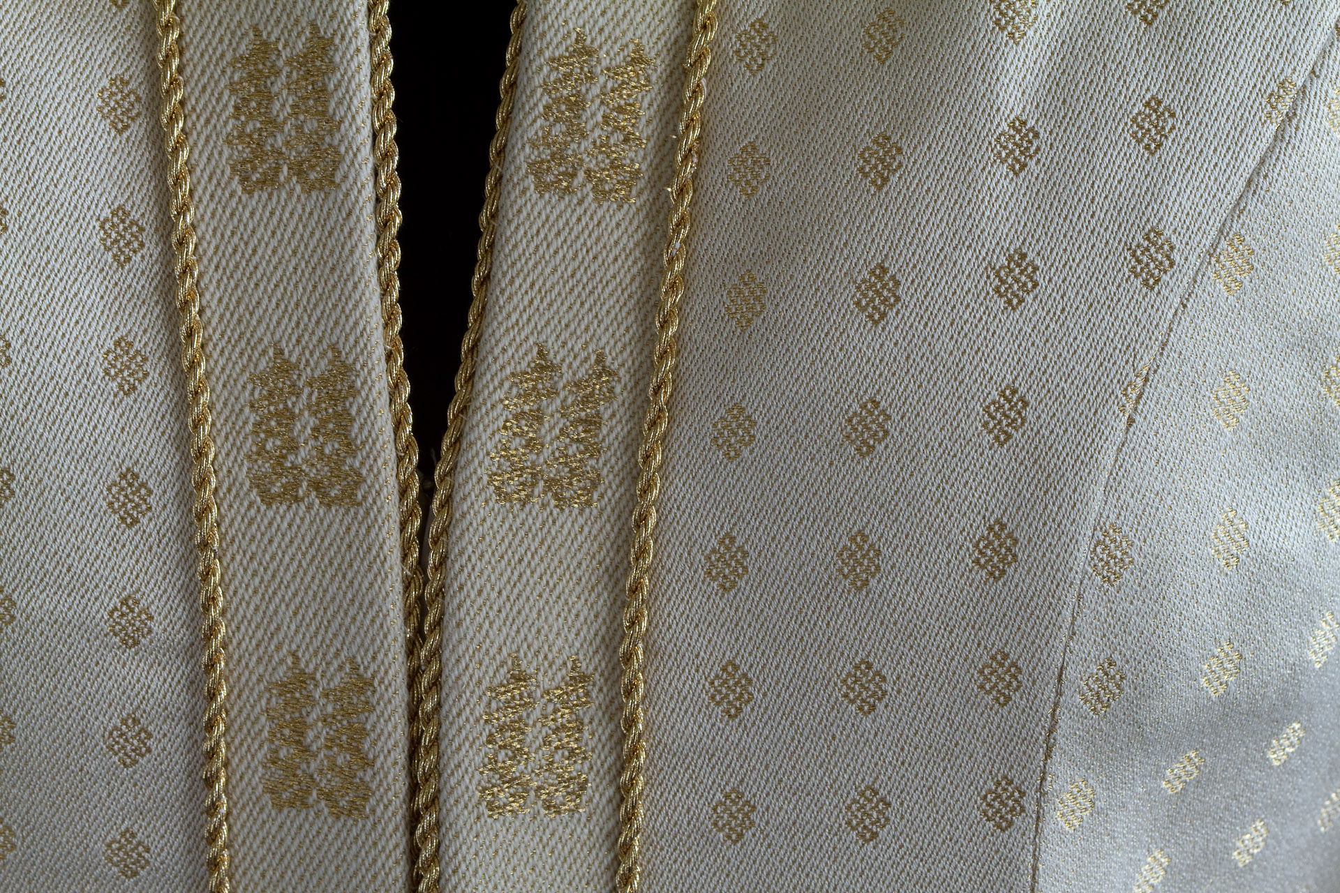Closeup of front opening in handwoven wedding dress
