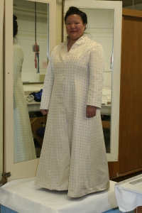 A front view of the partially finished handwoven wedding-coat