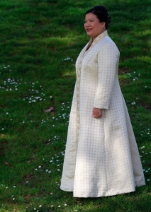 three-quarter view of handwoven wedding dress / coat