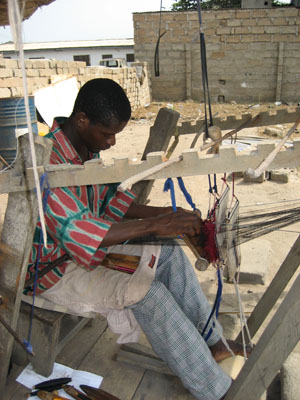 Eddie the weaver weaving in Ghana