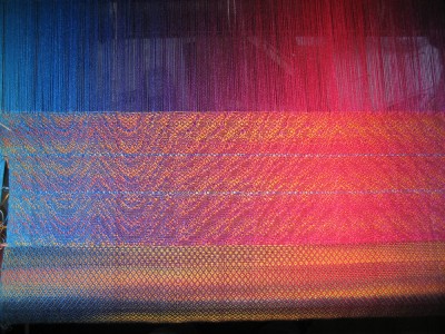 Knitted blank dyed in vertical stripes, unraveled and woven up