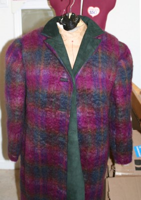 The coat with set-in shoulder pads.  Notice how the shoulders now appear to be of equal height!