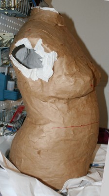 Brown paper tape dress form that Mike made, side view