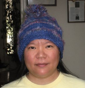 Funky knitted hat with pom-pom