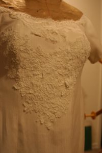 handwoven wedding dress with basted-on Alencon lace, close up
