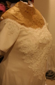 handwoven wedding dress with basted-on lace, three-quarter view