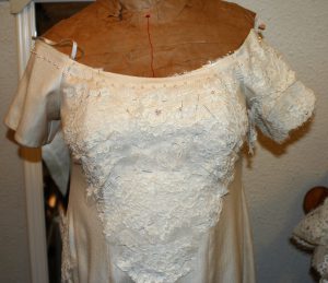 Handwoven wedding dress, with lace on one sleeve