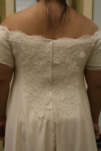 handwoven wedding dress, partially complete, closeup of back