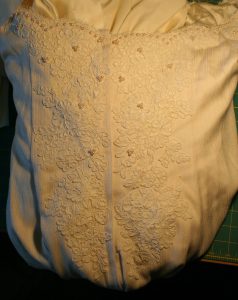 lace and pearls on back of handwoven wedding dress