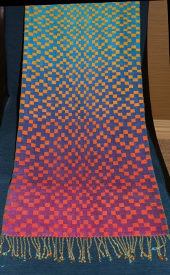 completed handwoven doubleweave shawl, blue/purple/fuchsia background