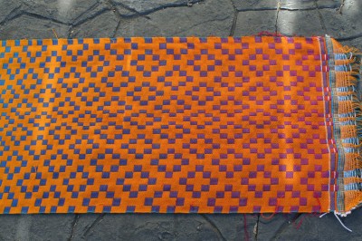 Second handwoven doubleweave shawl, orange side, end view