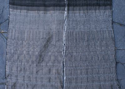 Waffle weave, networked and allover pattern, with white 60/2 silk weft, beaten firmly.  Warp is black 60/2 silk sett at 40 epi.