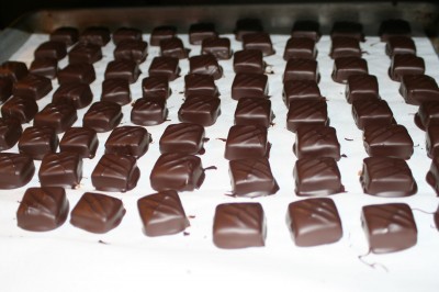 Chocolate covered jasmine vanilla caramels. The diagonal ridges on top are made by touching the freshly dipped chocolate lightly with the dipping fork.