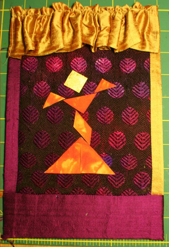 Front cover of book (handwoven fabric in background)