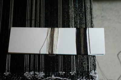 qiviut yarn, wrapped on white and on black silk, no flash