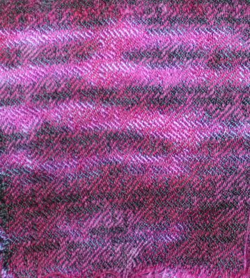 arashi shibori fiber-reactive dye in purple and black, followed by scrunch-dyeing in red/purple acid dye.  Complex weave pattern.