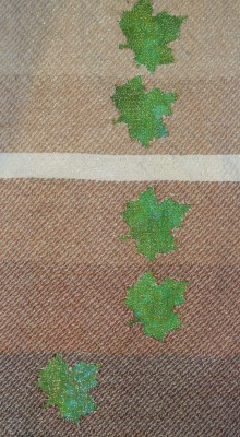 devore, various values of brown weft against a cross-dyed green background