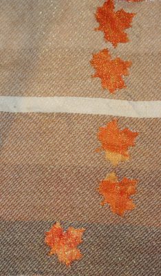 devore - various values of brown weft against an orange scrunch-dyed background