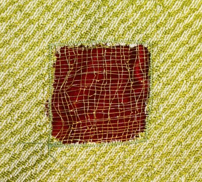 devore square, metallic gold thread against red velvet