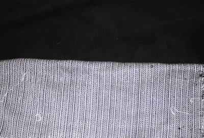 Celtic braid fabric against black leather