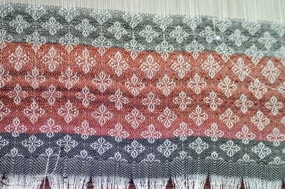 header with painted weft