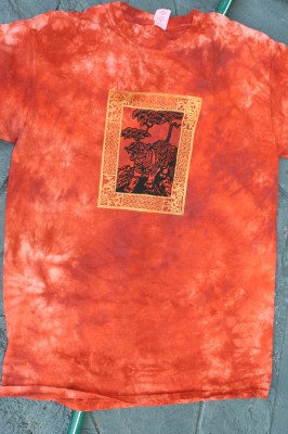 bordered tiger print on rust-colored fabric