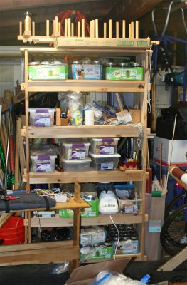 the shelf packed with weaving equipment