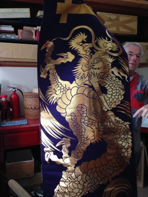 A banner woven from lacquered paper