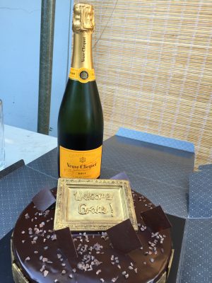 Welcoming Grace with cake and champagne!