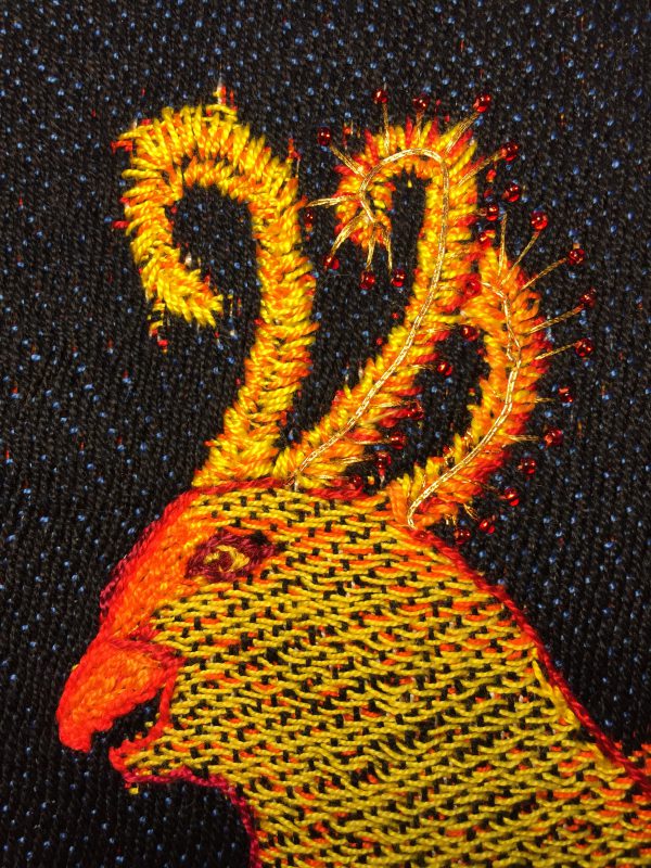 partially embroidered handwoven phoenix head