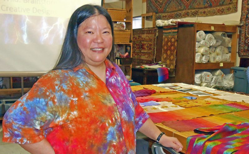 Tien talking at the San Diego Weavers Guild