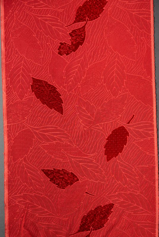 Japanese velvet piece showing red cut-velvet leaf design against uncut and voided velvet patterning