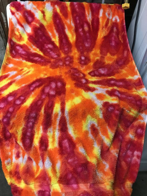 Tie-dyed towel - yellow-orange and scarlet-fuchsia ice dyed spiral