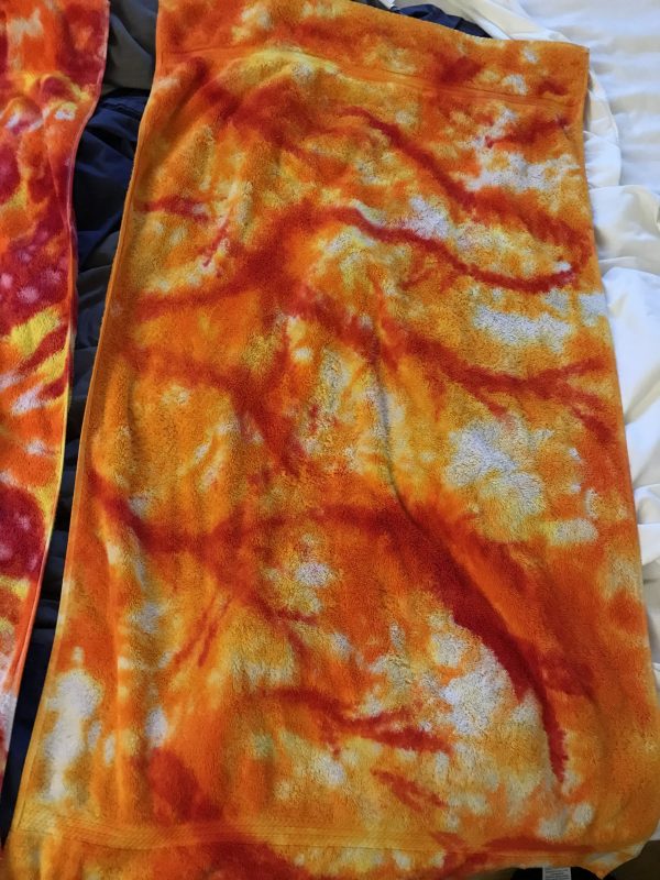 image of tie-dye towel with randomly painted lines
