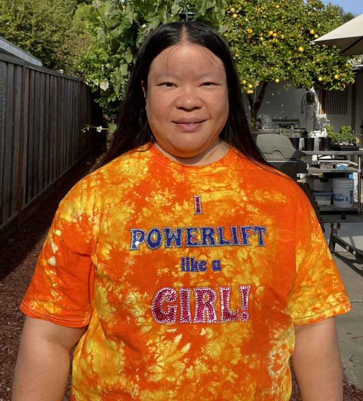 Tien in an "I Powerlift Like a Girl" T-shirt