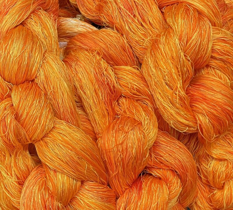 warp dyed in many shades of orange, yellow, and red
